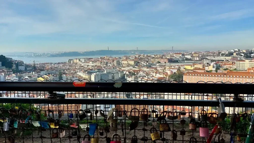 Love padlocks fastened to railings in Senhora do Monte Viewpoint
